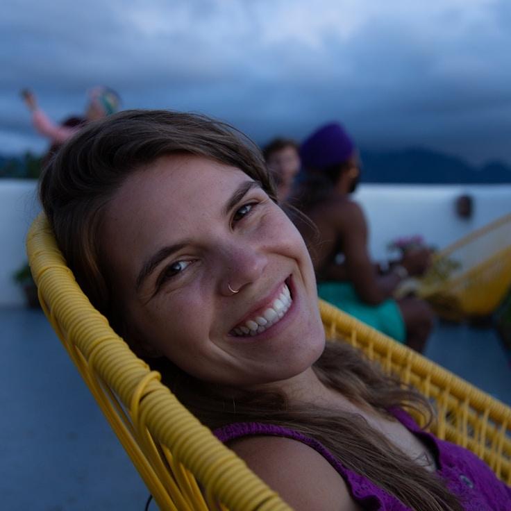 Kaveri Mehta, Lead Design Curator at QuietStoneCraft, reviewing corporate floral arrangements